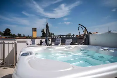 Image de Appartement de vacances avec terrasse sur le toit et bain à remous