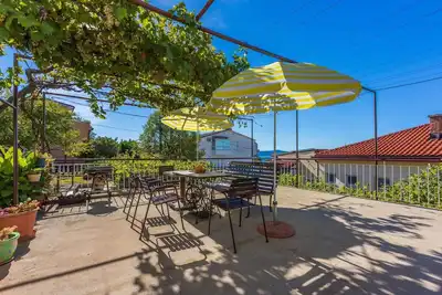 Image de Appartement de vacances avec terrasse, climatisation et vue sur la mer