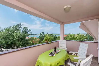 Image de Appartement de vacances avec air conditionné et vue sur la mer
