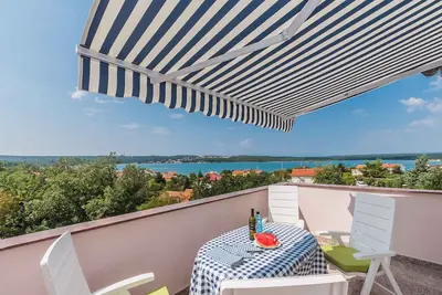 Image de Appartement de vacances avec climatisation et vue sur la mer