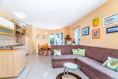 Image de Appartement de vacances avec air conditionné, jardin et barbecue