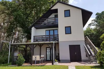 Image de Maison de vacances avec une vue magnifique avec une terrasse directement sur le lac