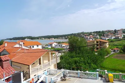 Image de Appartement de vacances avec air conditionné et vue sur la mer