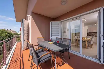 Image de Appartement de vacances avec balcon et jardin à usage commun