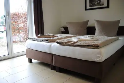 Image de Chambre double avec terrasse - Hôtel & Suites Usedom-Bike *** 80 m de la plage de la mer Baltique