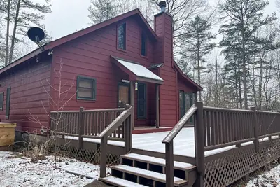 Image de Cabine parfaite avec bain à remous privé, espace de pont, cheminée et plus