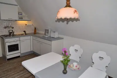 Image de Appartement mansardé confortable avec vue sur l'Ochsenkopf
