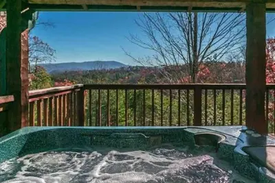 Image de Véritable cabane en rondins avec lit suspendu plein air!