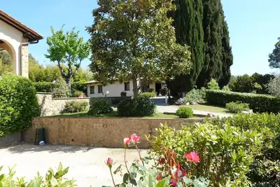 Image de Cottage. Dependance Il Borraccio con vista giardino sulla campagna del Chianti.