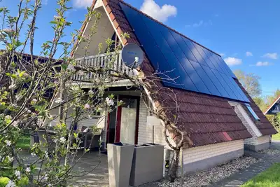 Image de Maison de vacances de Druif 6p avec une belle terrasse près du lac Lauwersmeer