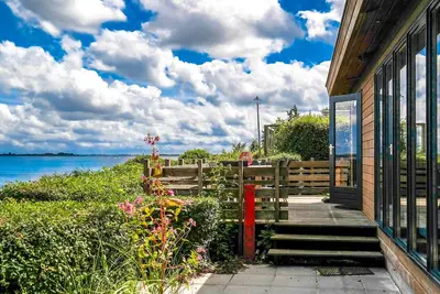 Image de 6 pers Lauwersmeer front de mer, Maison entièrement équipée et moderne avec sauna