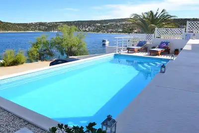 Image de Maison de vacances sur la plage avec piscine privée chauffée et bouée