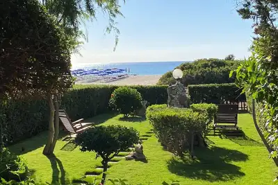 Image de Maison de vacances avec jardin qui arrive sur le sable