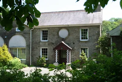 Image de Coachhouse familial dans un cadre idyllique avec de vastes terrains privés et WiFi gratuit