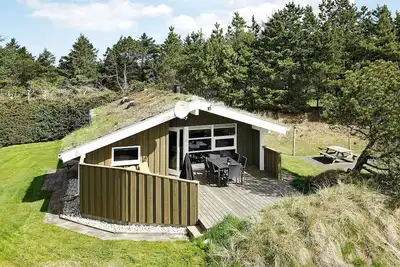 Image de Maison de vacances pour 6 a Blokhus-By Traum