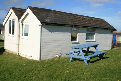 Image de Wee Cott est un chalet de vacances indépendant de style traditionnel. Activer