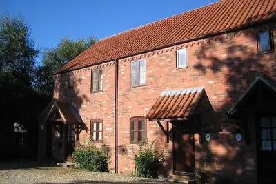 Cottage dans un cadre paisible au bord du lac avec des plages, des promenades et les Broads à proximité