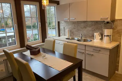 Image de Appartement dans l'ancienne ferme, avec poutres et fenêtres en treillis