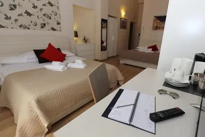 Image de Chambre quadruple avec vue sur la basilique de San Giovanni in Laterano