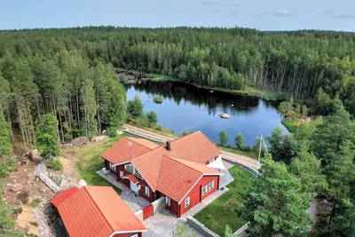 Image de Maison de rêve sur le lac avec sauna, cheminée, Wi-Fi, galerie / grenier, bateau, canoë, garage double