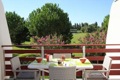 Image de Appartement standing 45m2 Golf + piscine privée + 5 minutes plage vélo voiture