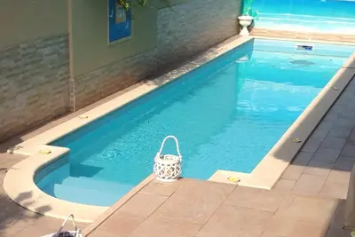 Image de Villa Le Tre Palme. . . Suite dans la détente. . . immergé dans le jardin verdoyant avec piscine