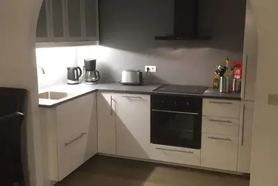 Image de Apartm. dans une maison familiale avec 2 chambres. et un salon avec 2 lits