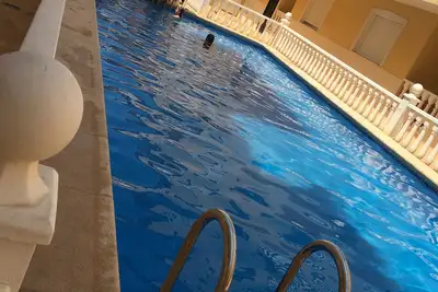 Image de Appartement de 2 chambres près du terrain de golf et de la plage avec piscine commune isolée