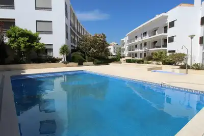 Image de Appartement au rez-de-chaussée avec piscine, emplacement central