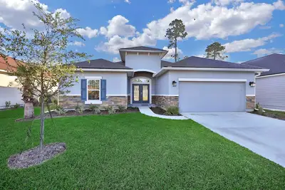 Image de Ranch de 3 chambres près de l'aéroport de Jax cette charmante maison est aménagée pour jouer ou travailler.