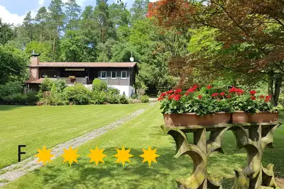 Image de ***** Ferienhaus Naturliebe 🦋 6000m² parc jardin en forêt, clôturé, cheminée, sauna
