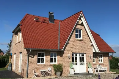 Image de Maison frisonne \"Strandhus\" près de la plage, WiFi gratuit, cheminée et sauna