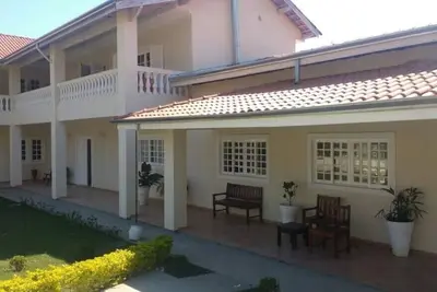 Image de Chacara avec 9 suites. w / air clignotant. etc.