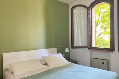 Image de Confortable appartement de trois pièces Jolly équipé de tout le confort, avec jardin et terrasse.