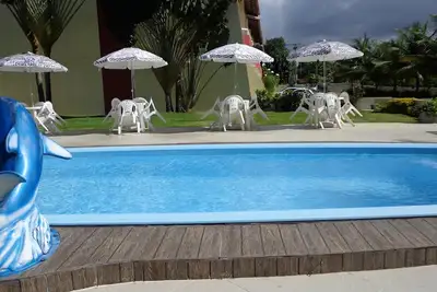Image de Grand Village, en hausse, 3 suites, près de la plage