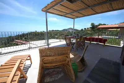Image de Villa neuve, grande terrasse avec vue sur la mer. Entre l'art. Margherita et Chia.