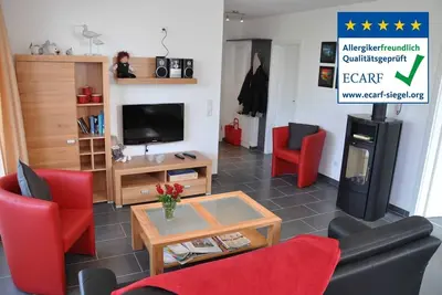 Image de Près de la plage, appartement de haute qualité avec un sauna, cheminée, chaise de plage et Wlan