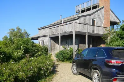 Image de Maison à l'envers près de la plage avec vue imprenable sur la lande et l'océan