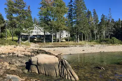 Image de Luxe, retraite en bord de mer avec plage privée et couchers de soleil glorieux