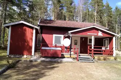 Image de Maison de vacances dans les bois incluse Bateau à rames - lac avec jetée