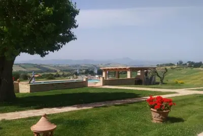 Image de Olivo apartment, 180 sqm, with private porch and shared swimming pool.