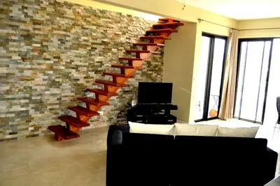 Image de Penthouse + Vues panoramiques inspirantes sur Flic en Flac. Terrasse sur le toit de 100m2