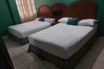Image de Chambre standard avec deux lits.