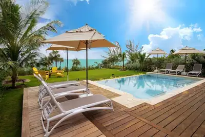Image de Brand New Beachfront House w / piscine privée, privilèges et commodités Resort