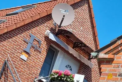 Image de Vos vacances 🌅 avec une vue romantique sur le premier moulin à Greetsiel <br>