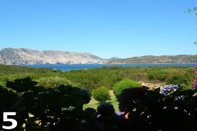 Image de Cala Paradiso, Capo Coda Cavallo, plage à 150m, amarrage bateau, balade Zodiac.