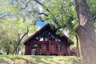 Image de 1 Log / 1 Bath Log Cabin avec d'excellentes vues sur le front de mer et des équipements de la station