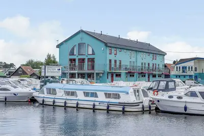Image de 4 chambres à coucher à Wroxham