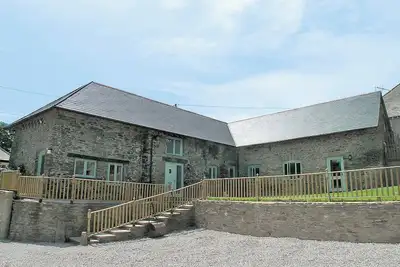 Image de 4 chambres à coucher à Wembury