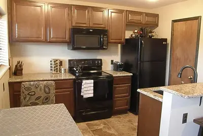 Image de Condo rénové, comptoirs en granit, planchers chauffants - Au coeur de Fairplay